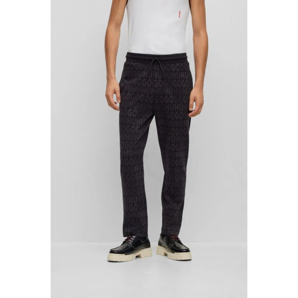 Cotton tracksuit bottoms with drawstring waist and monogram jacquard