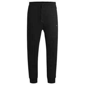 Stretch tracksuit bottoms with logo patch