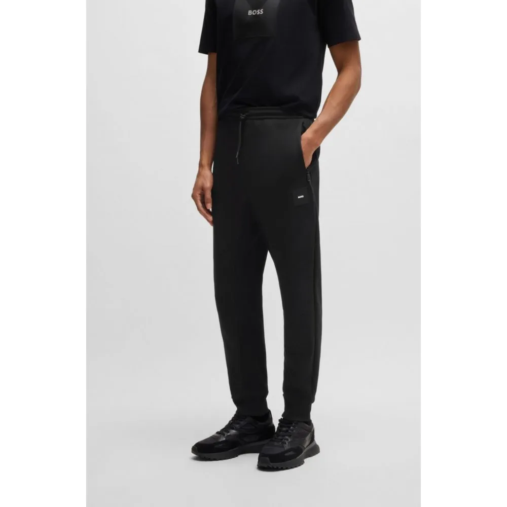 Stretch tracksuit bottoms with logo patch