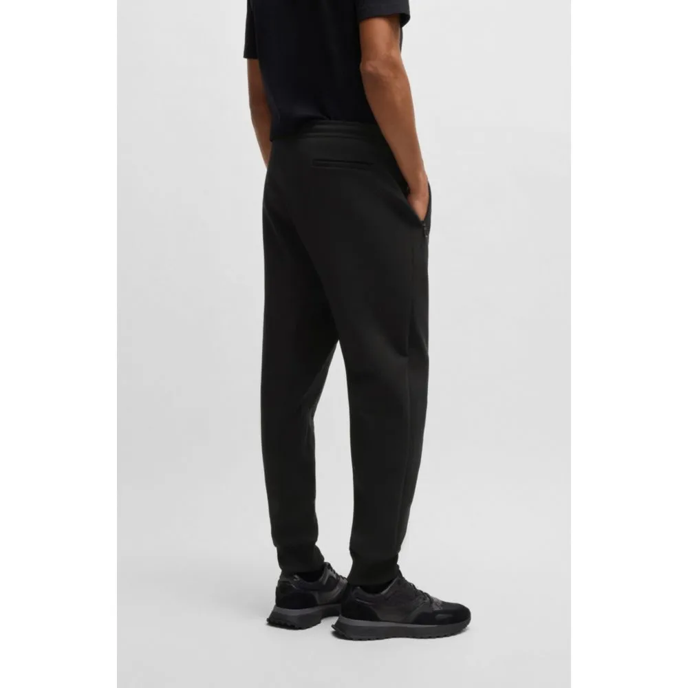 Stretch tracksuit bottoms with logo patch