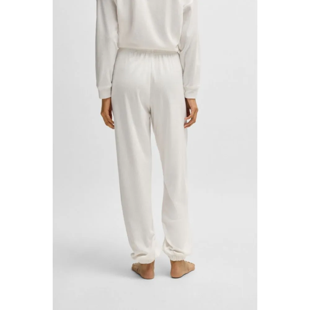 Tracksuit bottoms with red logo label
