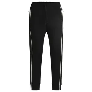 Tracksuit bottoms with tape inserts