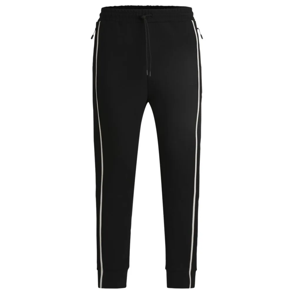 Tracksuit bottoms with tape inserts
