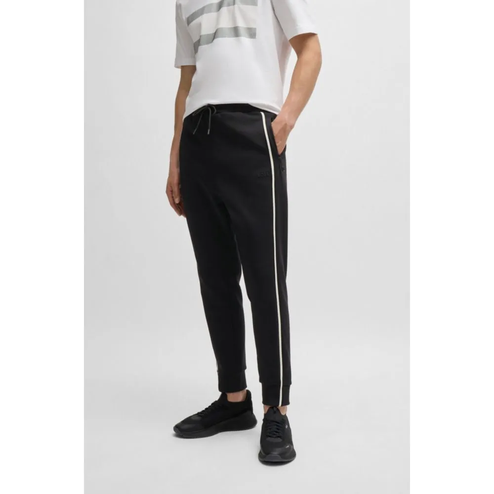 Tracksuit bottoms with tape inserts