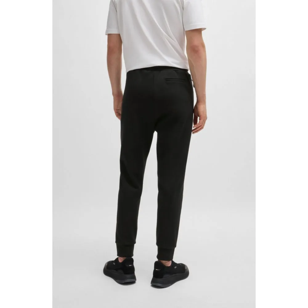 Tracksuit bottoms with tape inserts
